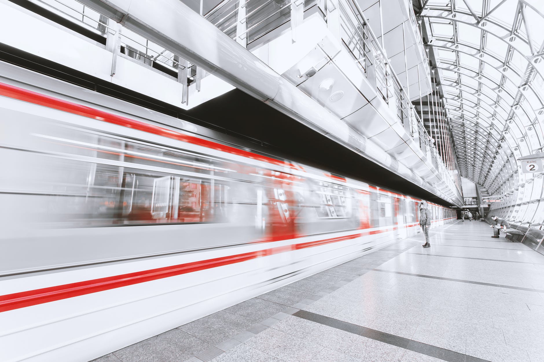 blurred motion of illuminated railroad station in city